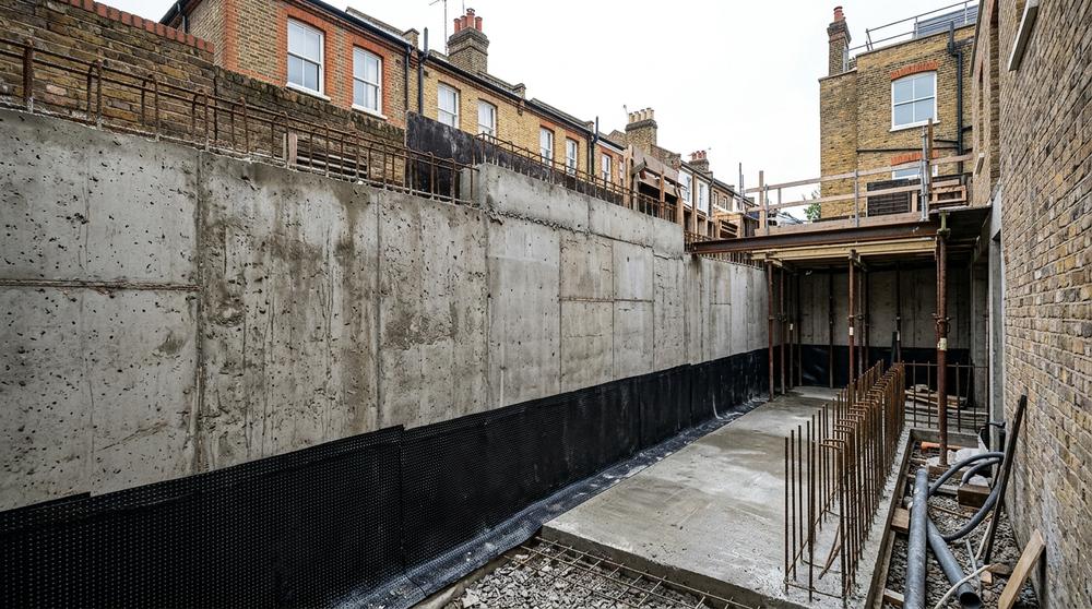 Reinforced concrete retaining wall in a RBKC basement